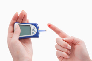 Close up of a blood glucose meter utilization