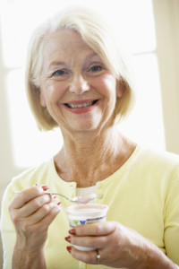 Senior Woman Eating Yogurt