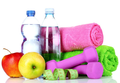 towel, dumbbells, apples and water bottle isolated on white