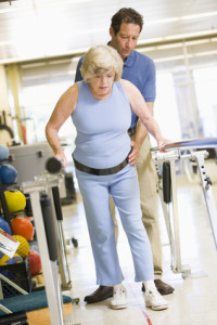 Physiotherapist With Patient In Rehabilitation