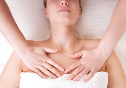 Therapist doing massage releasing tension by pressing chest on p