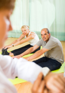 Medical staff with senior people at gym