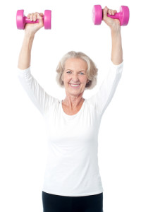 Senior woman exercising with dumbbells