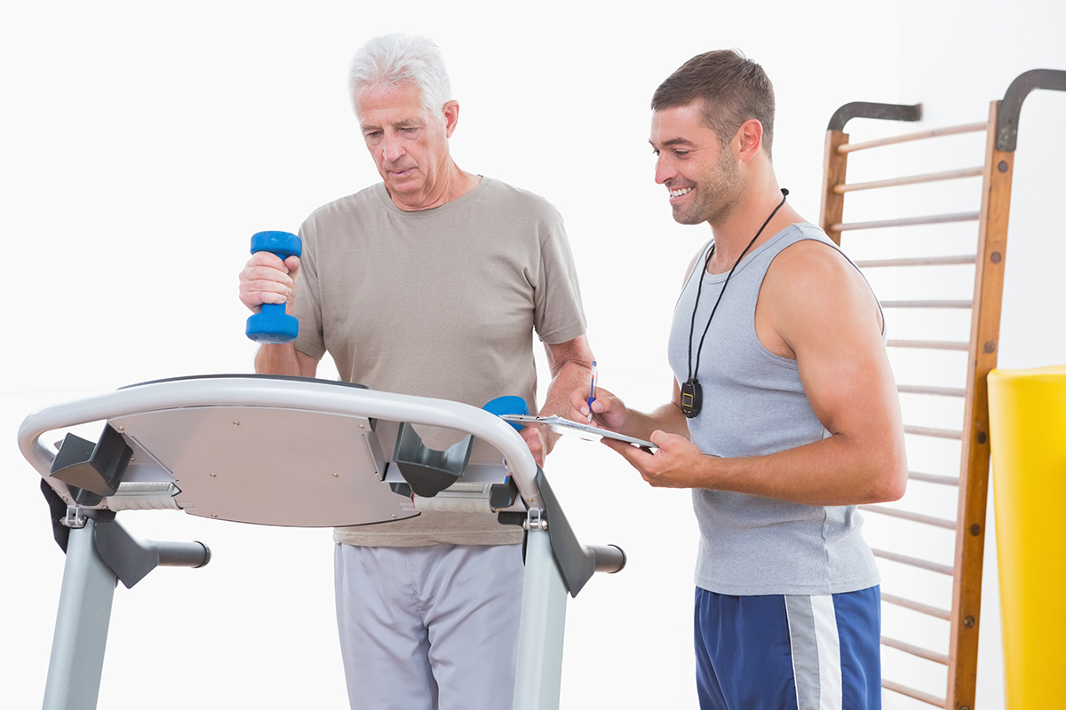 senior-man-and-trainer-treadmill