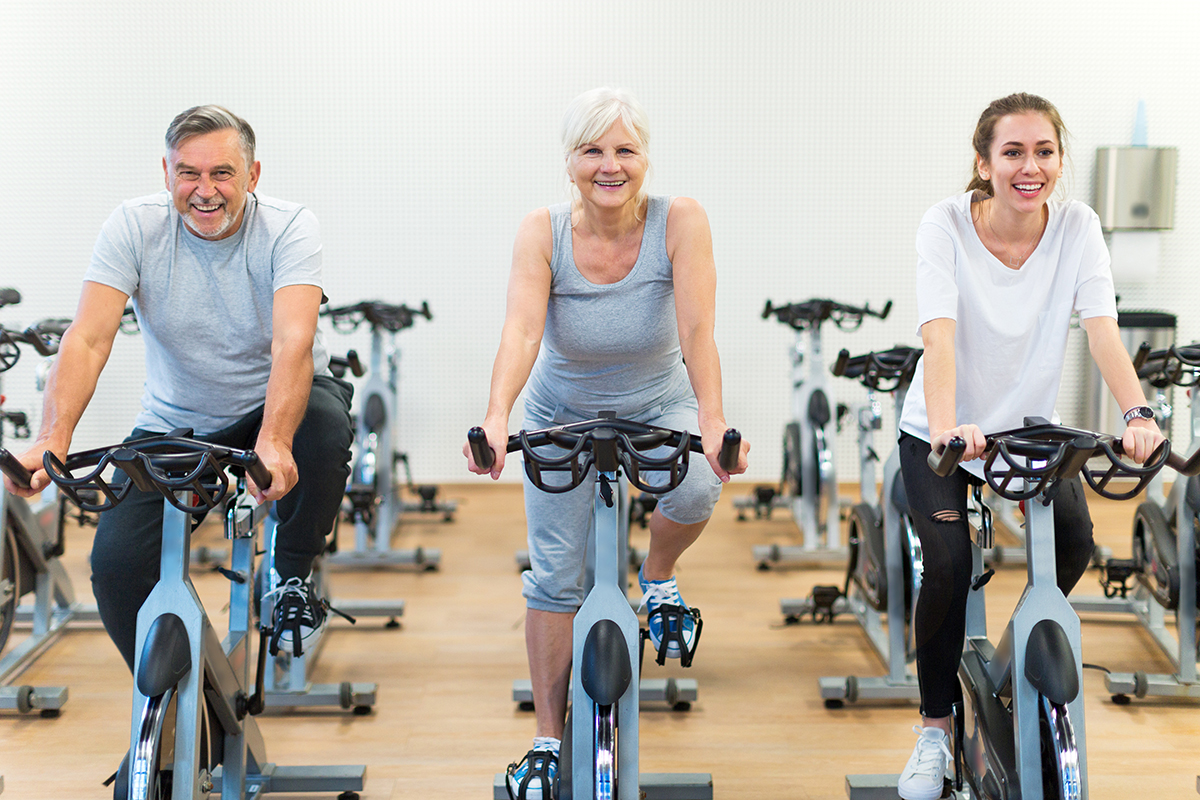 seniors-biking-in-gym-group