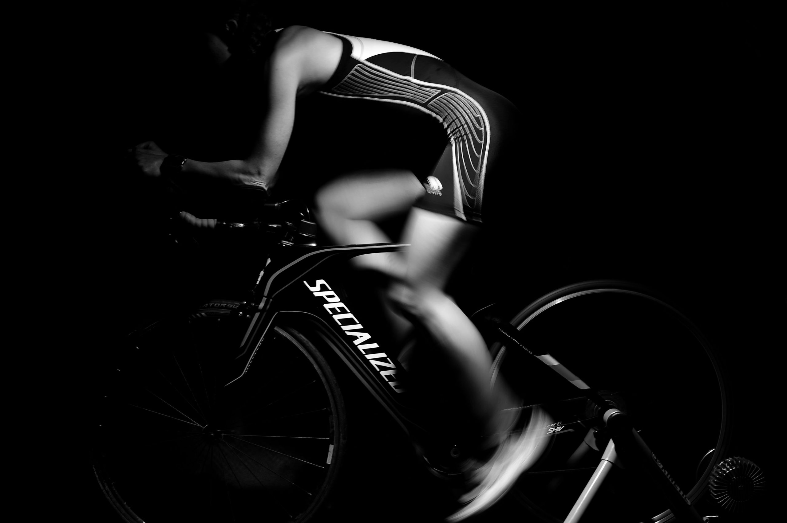 athlete riding indoor cycle